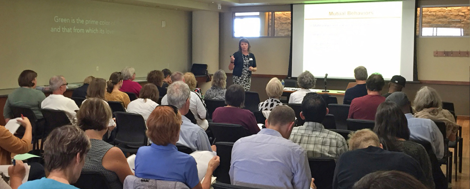 Sherry speaking at a session.