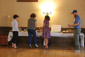 book club participants taking a break at the food table