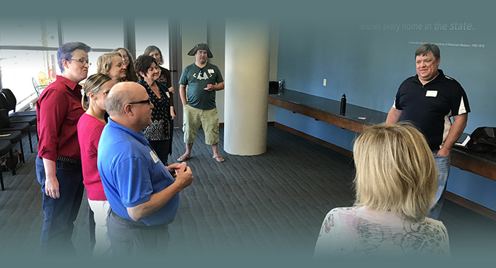 Jason Erdmann from Leadership Improv talking to a group