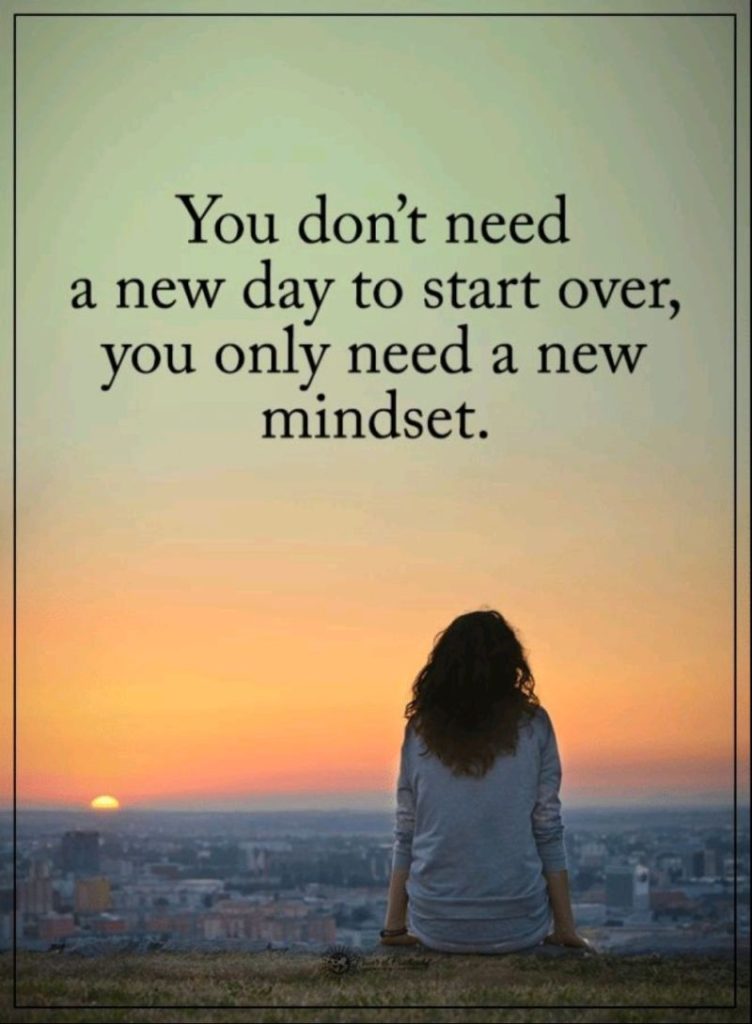 Photo of woman at sunrise with quote: "You don't need a new day to start over, you only need a new mindset."