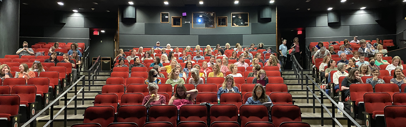 The attendees of Gratitude Revealed finding their seats at the Marquee Theater in Union South May 24, 2023